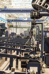 Machine for the production of spiral fin. Finned tube production. High frequency welding line.