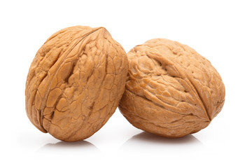 Delicious whole walnuts, isolated on white background
