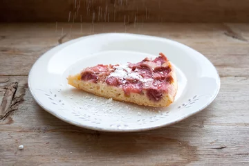 Foto op Plexiglas Piece of round strawberry berries tart pie pudding on white plate on rustic wooden background © geniousha