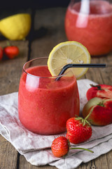 Glass of Tasty Strawberry Peach Smoothie with Lemon on Linen Napkin Wooden Background Fresh Strewberry Peach and Lemon Heathy Diet Drink Refreshing Summer Drink