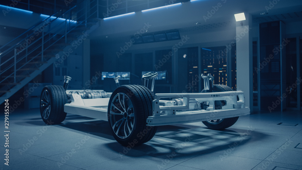 Poster concept of authentic electric car platform chassis prototype standing in industrial machinery design