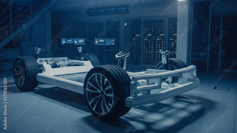 Poster concept of authentic electric car platform chassis prototype standing in industrial machinery design