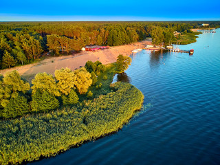 Beautiful panoramic aerial drone view to the place of connecting the Bug and Narew rivers with a warm summer day in July, Poland, Masovian
