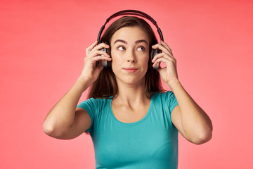 young woman listening to music with headphones