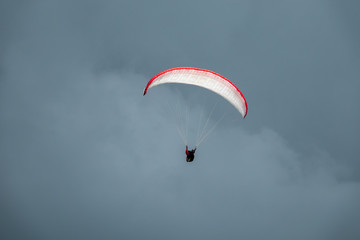 Paraglider in flight with the sky in background