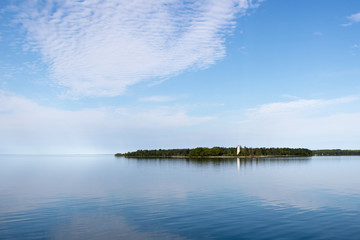 landscape with lighthouse, lake and clouds