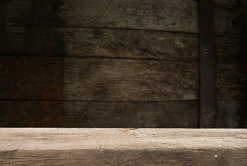 Beer barrel with beer glasses on a wooden table. The dark brown background.