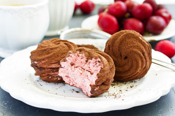 Homemade marshmallows with cherries and chocolate.