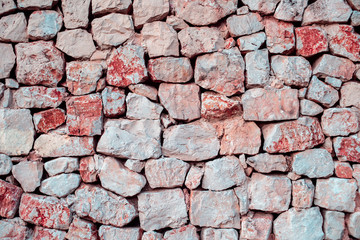 Red Ancient Stone or Rock Wall..Old stone wall texture background.