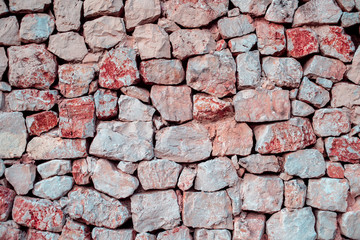 Red Ancient Stone or Rock Wall..Old stone wall texture background.