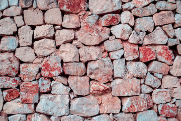 Red Ancient Stone or Rock Wall..Old stone wall texture background.
