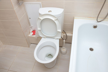 White toilet bowl in the bathroom