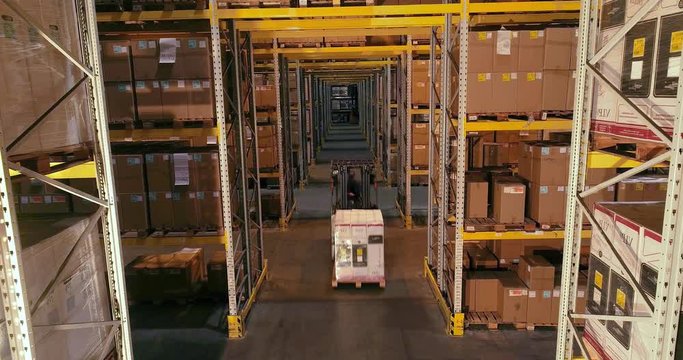 Workflow in a warehouse, active work in a warehouse, forklifts in a warehouse