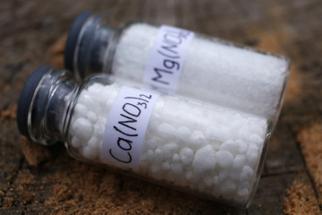The best chemicals for plants, mineral fertilizers: calcium nitrate and magnesium nitrate in glass...