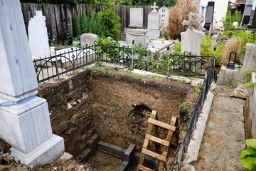 Large grave plot dug deeply out in order to bury a deceased family member in a Christian cemetery