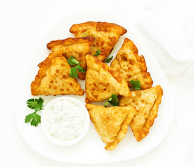 Asian food. Vegetarian samsa (samosas) with tomato sauce