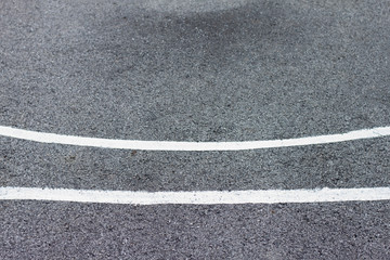 Fototapeta premium White line markings on the black asphalt.