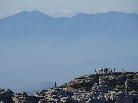 sierra de mijas con grupo de excursionistas sobre la proa del barco del torcal de antequera malaga 