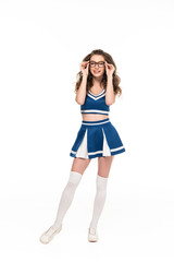 Fototapeta premium sexy happy cheerleader girl in blue uniform and glasses isolated on white