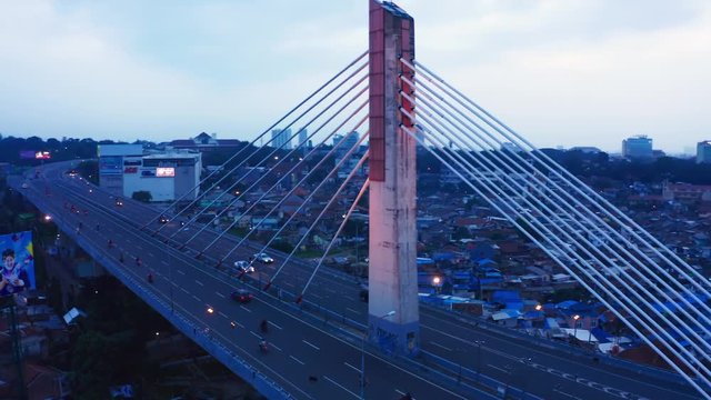 BANDUNG, Indonesia - July 03, 2019: Aerial view of Pasupati Bridge at dusk time from a drone flying from right to left. Shot in 4k resolution