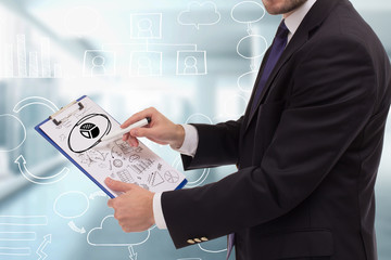 The concept of business, technology, the Internet and the network. A young entrepreneur working on...