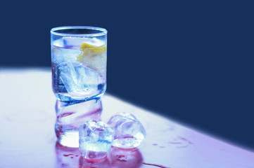 glass of water with ice and mint isolated on white