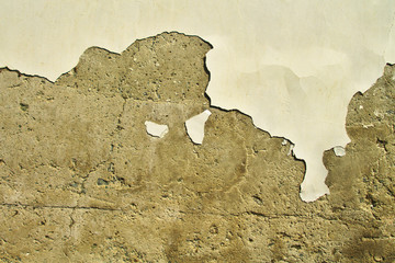 Old stone wall with peeling paint