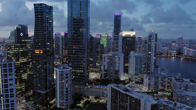 Aerial: Downtown Miami, condominiums & waterfront at night. Miami. Florida, USA