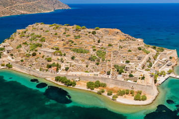 Aerial drone view of the ruins of the fortress and leper colony on Spinalonga island, Crete Greece