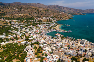 Fototapeta premium ELOUNDA, CRETE, GREECE - JULY 16 2019: Aerial view of the popular high-end tourist town of Elounda on the Greek island of Crete in the Aegean Sea.