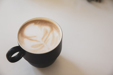 coffee of cup  on white table of wood copy space for youe text