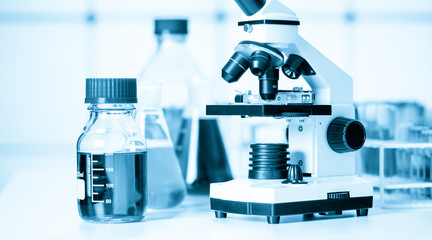 Test tubes and flasks and microscope in a chemical laboratory