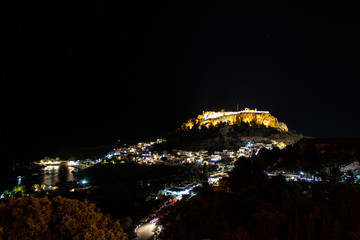 Lindos with the historic Acropolis at night on Rhodes, Greece