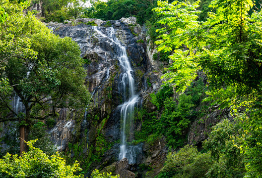 Waterfall in tropical forest at Khlong Lan National park, Kamphaeng Phet, Thailand. © Amnatdpp