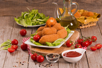 Supplì, italian fried rice balls.