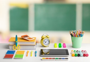 Big stack of books on  table