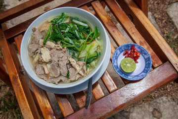 traditional Vietnamese pho soup, Vietnamese soup Pho  with chicken, view from above