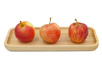 apples on a wood plate