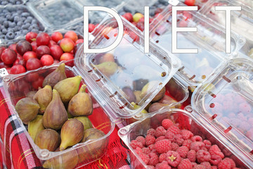 Fresh organic summer fruits on a farmer market. All kind of fruits. Plastic pollution. Diet and vitamins concept.