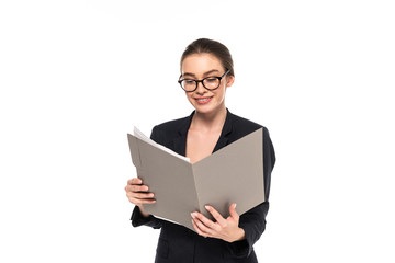Fototapeta premium young happy successful businesswoman in black suit and glasses reading documents in folder isolated on white