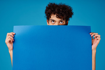 man holding blank board