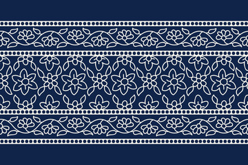 Woodblock printed indigo dye seamless ethnic floral border. Traditional oriental ornament of India, garland motif with primitive flowers, ecru on navy blue background. Textile design. - 279180609