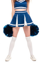 partial view of cheerleader girl in blue skirt and gaiters holding pompoms isolated on white