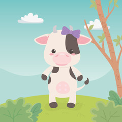 Obraz na płótnie Canvas cute and little cow in the field