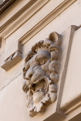lion head on a building wall