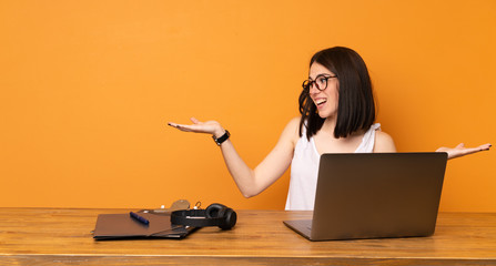 Business woman in a office holding copyspace with two hands