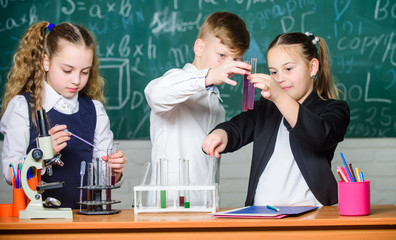 Chemistry science. Little kids scientist earning chemistry in school lab. biology experiments. Little children. Science. Lab microscope and testing tubes. Breathing life into chemistry