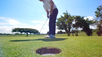 Successful golf swing held by the male player