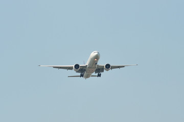 Passenger airplane landing at the airport