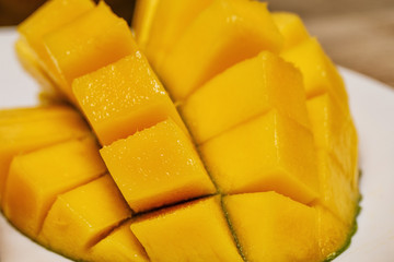 fresh juicy yellow Thai chopped mango on the table 